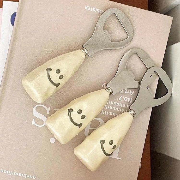 Cute smiley face beer bottle opener with a ceramic handle, stand-up design, creative stainless steel cap remover, bottle opener.