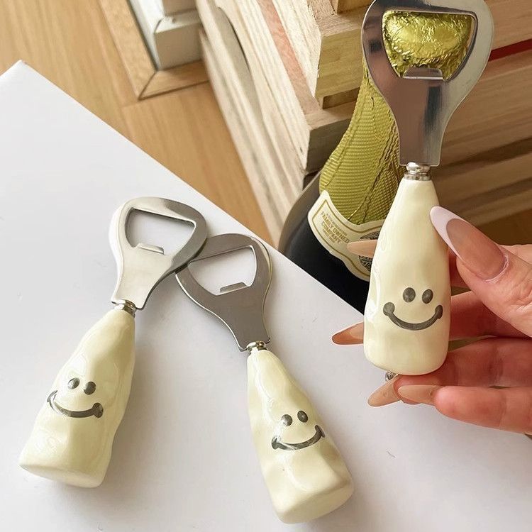 Cute smiley face beer bottle opener with a ceramic handle, stand-up design, creative stainless steel cap remover, bottle opener.