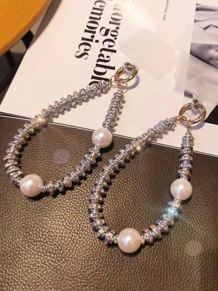 WhatsAppImage2024-10-04at09.37.50_c5aa46b7 Luxury Pearl and Rhinestone Phone Lanyard, Wrist Strap, Exquisite Crystal Bracelet Chain, Phone Strap Pendant for Women - Image 1