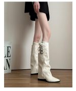 Cream knee-high buckle boots showing shaft and heel