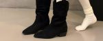 Pair of black pointed-toe slouch mid-calf boots